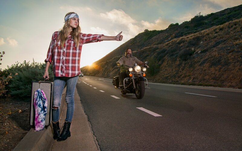 Woman Hitchhiking on Road — Red