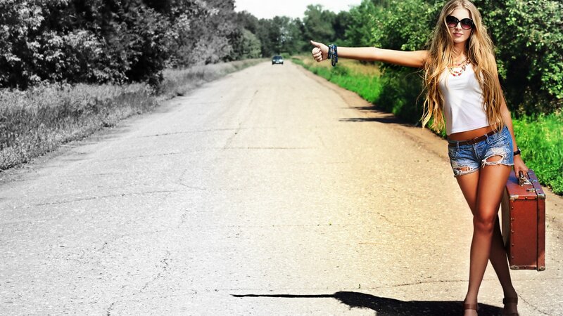 Woman Hitchhiking on Road — White