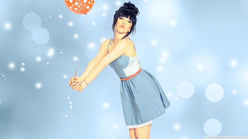 woman holding a balloon