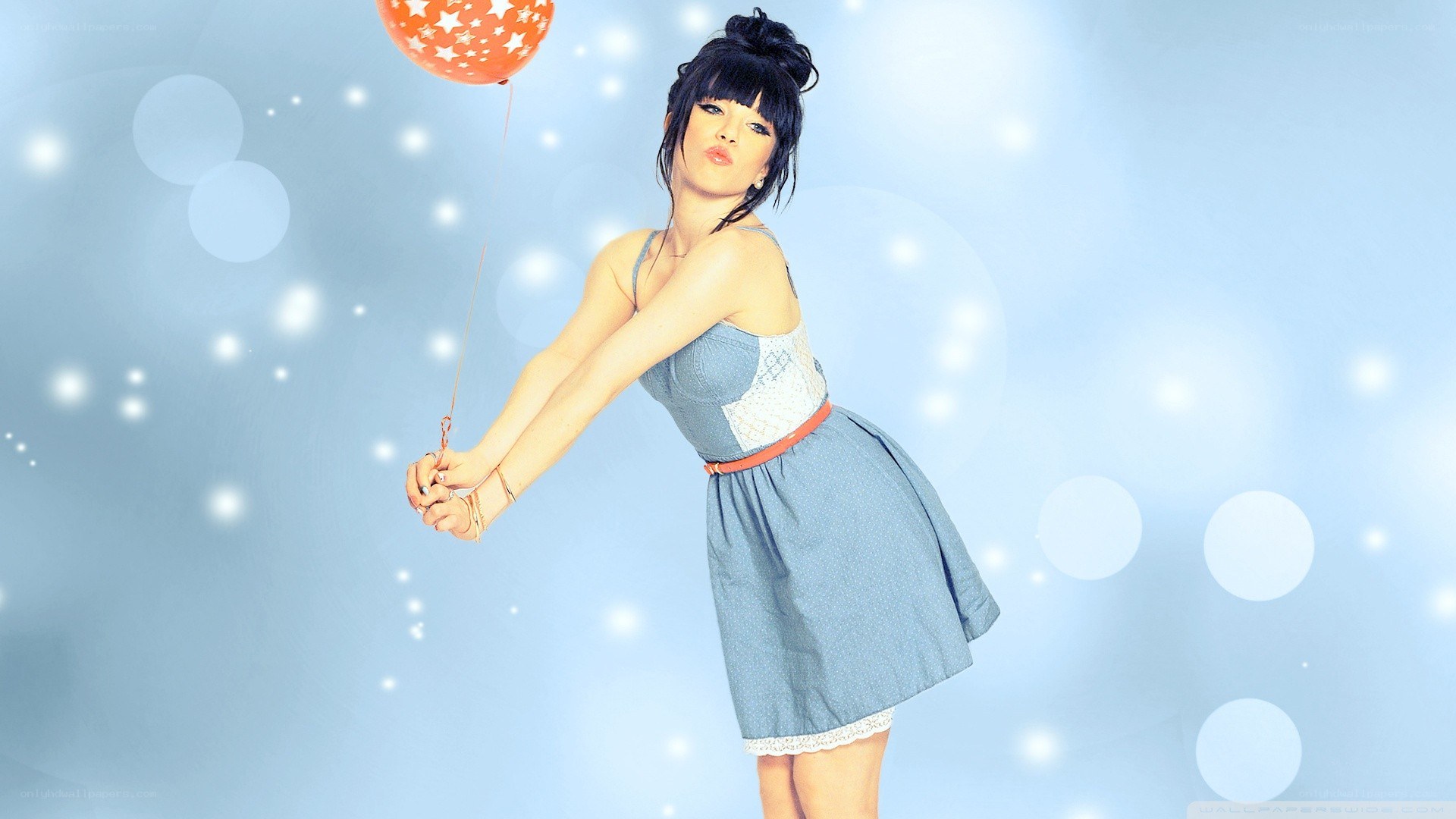 woman holding a balloon