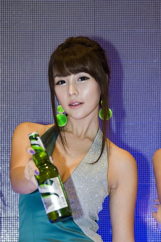 woman holding a beer bottle