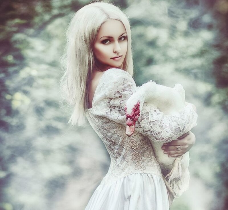 Woman Holding a Bird — White