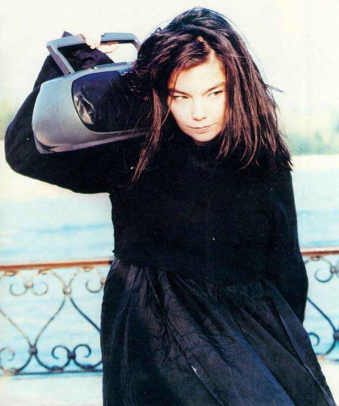 woman holding a boombox