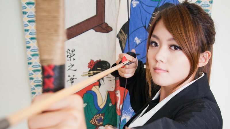 Woman holding a bow and arrow