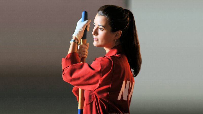 Woman Holding a Broom — Red