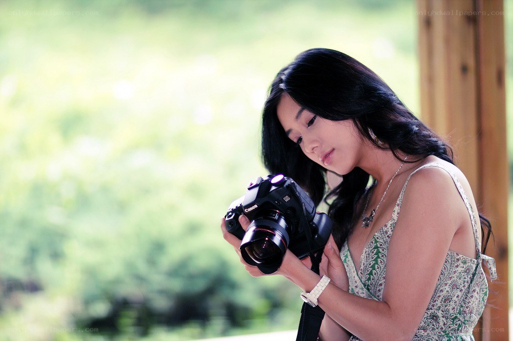 woman holding a camera