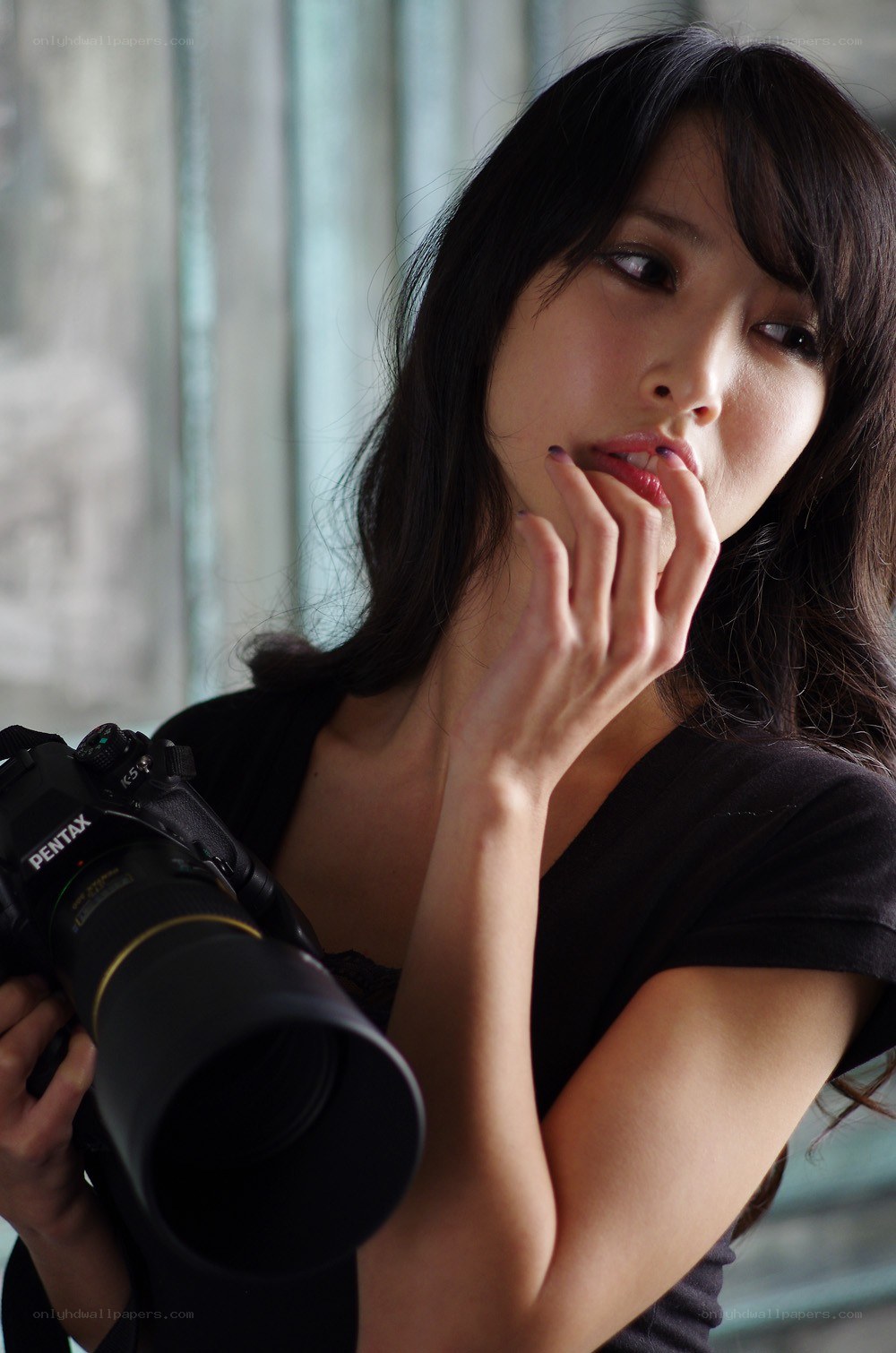 woman holding a camera