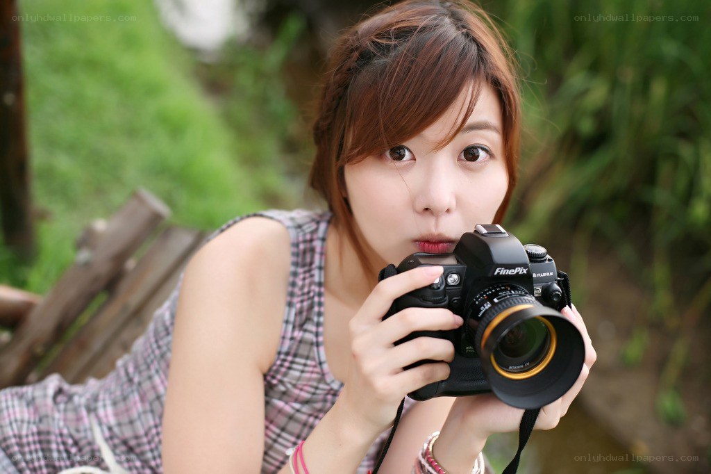 woman holding a camera