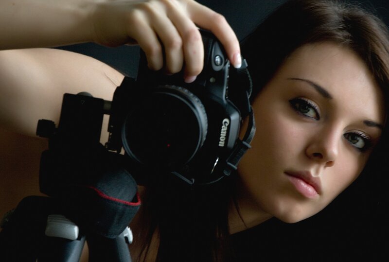 woman holding a camera