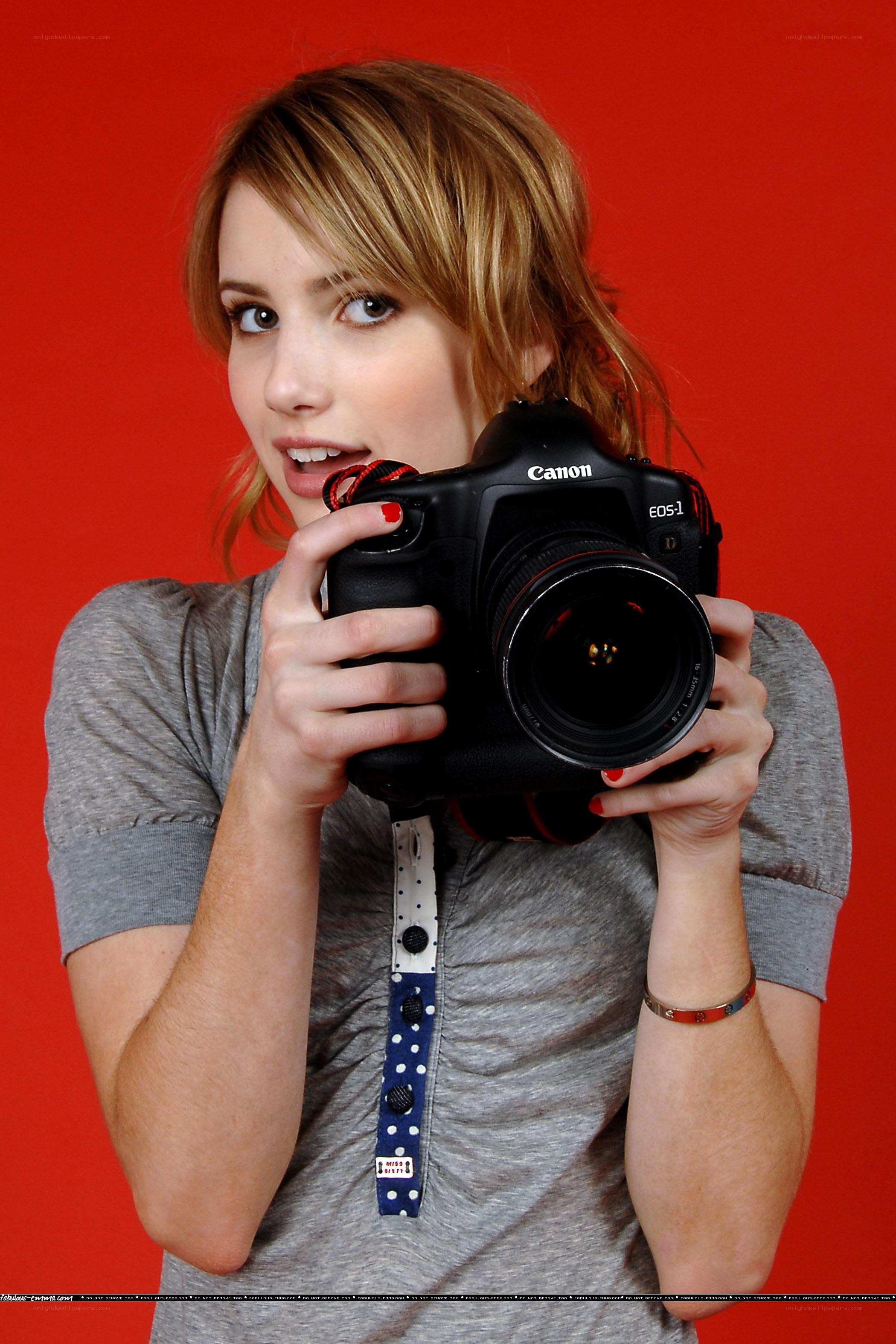 woman holding a camera
