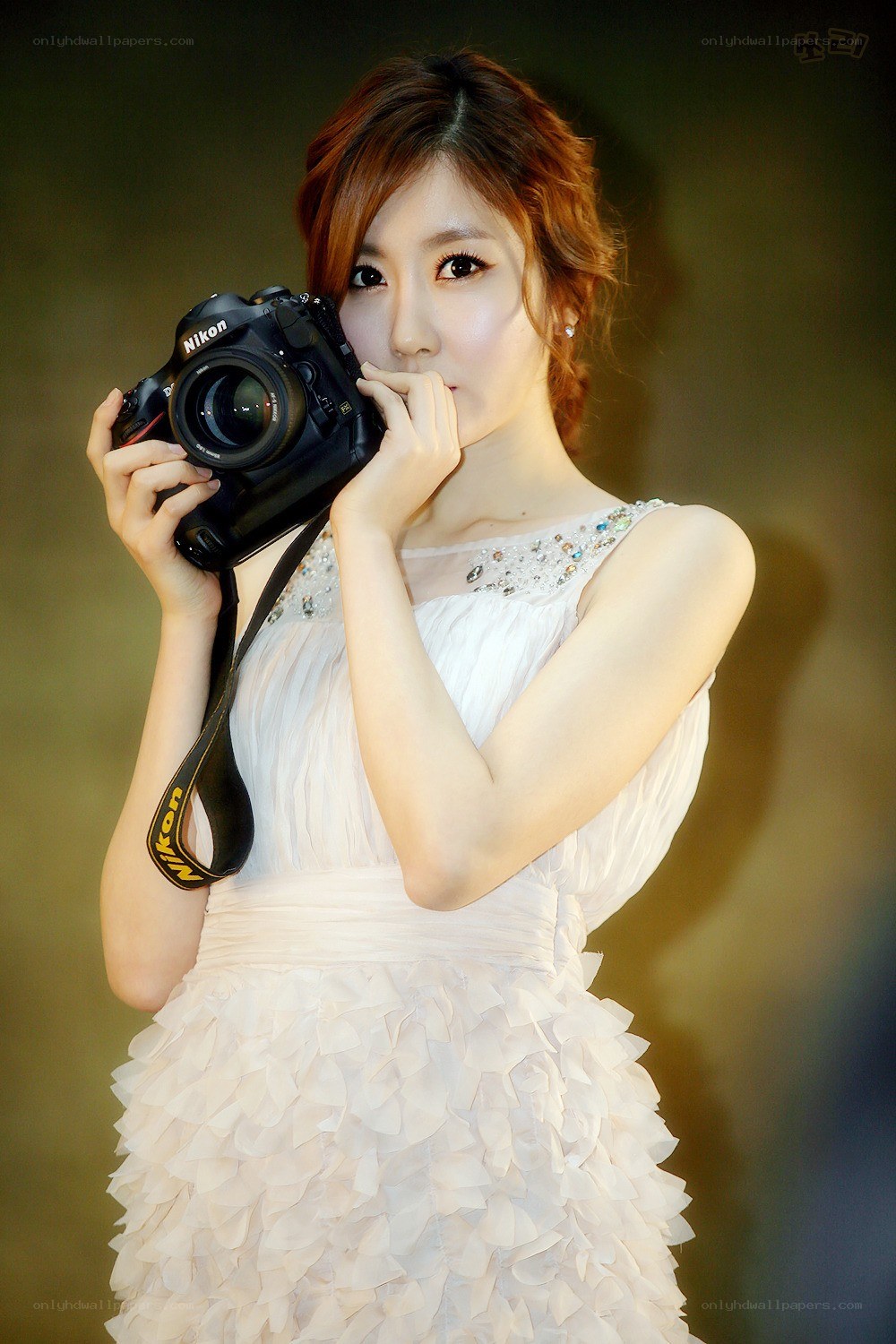 woman holding a camera