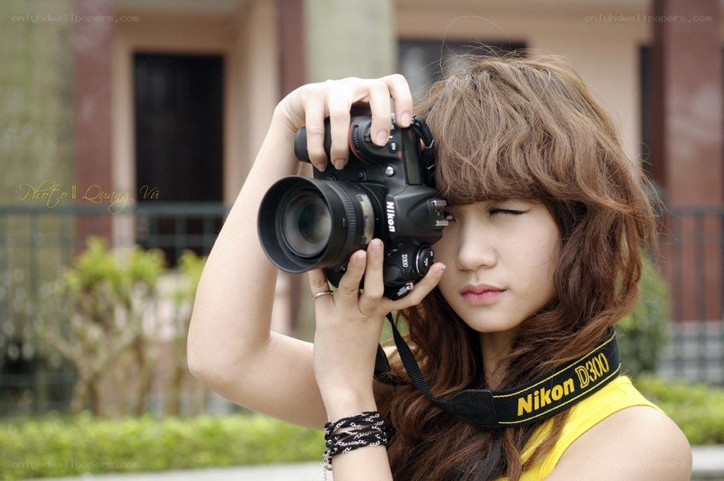 woman holding a camera