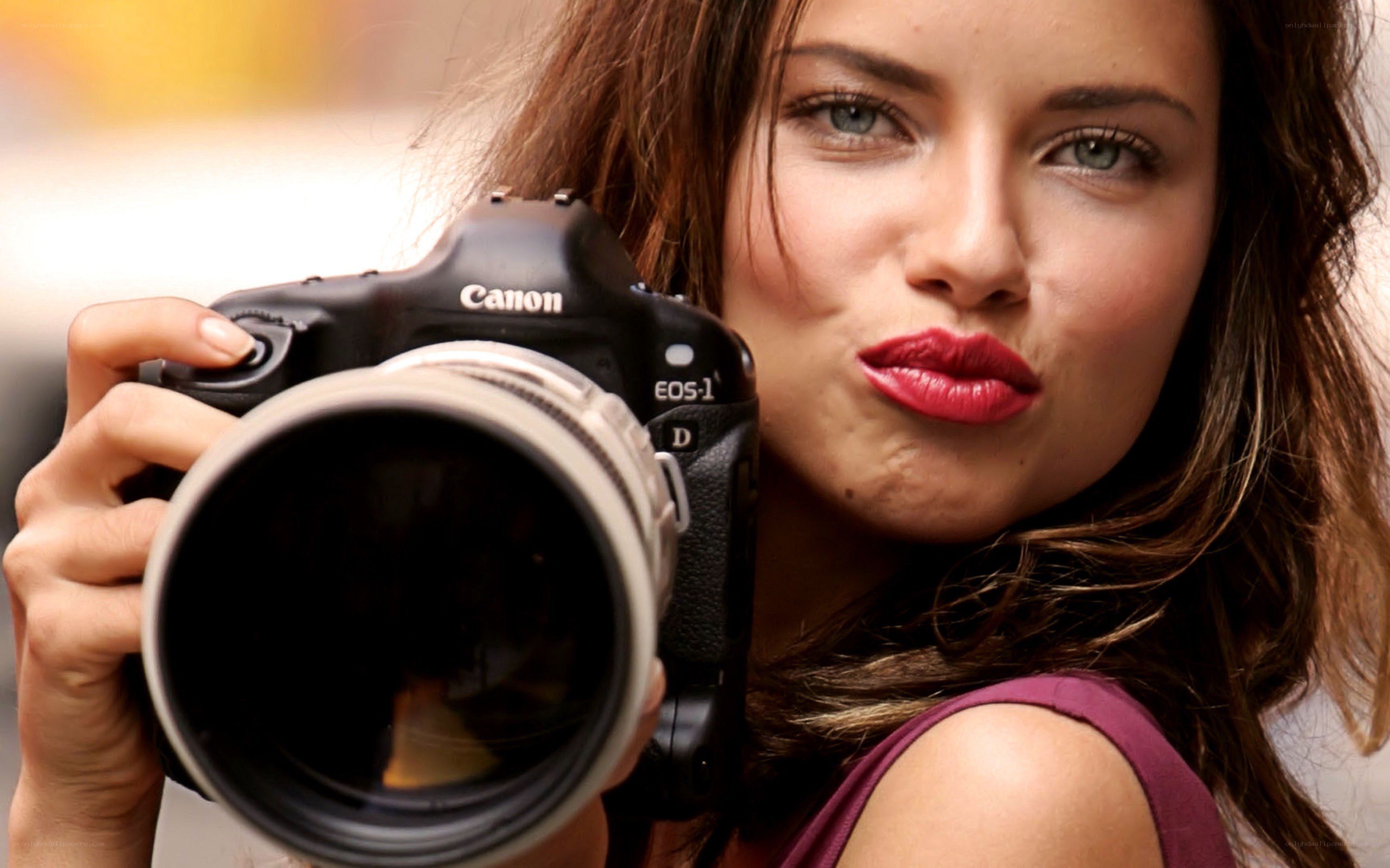 woman holding a camera