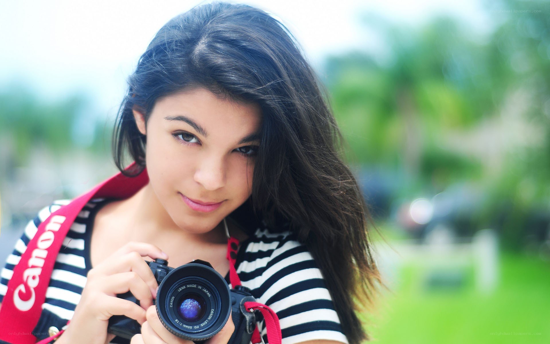 woman holding a camera