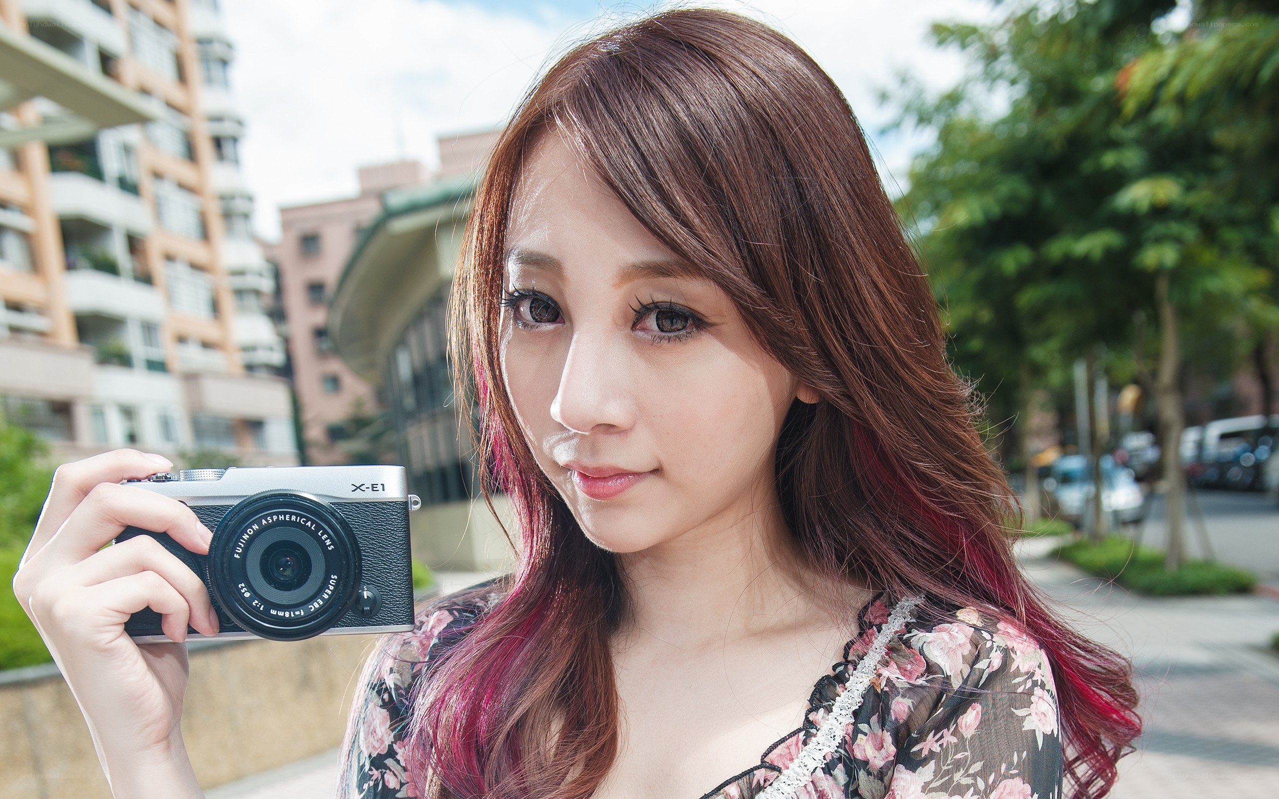 woman holding a camera