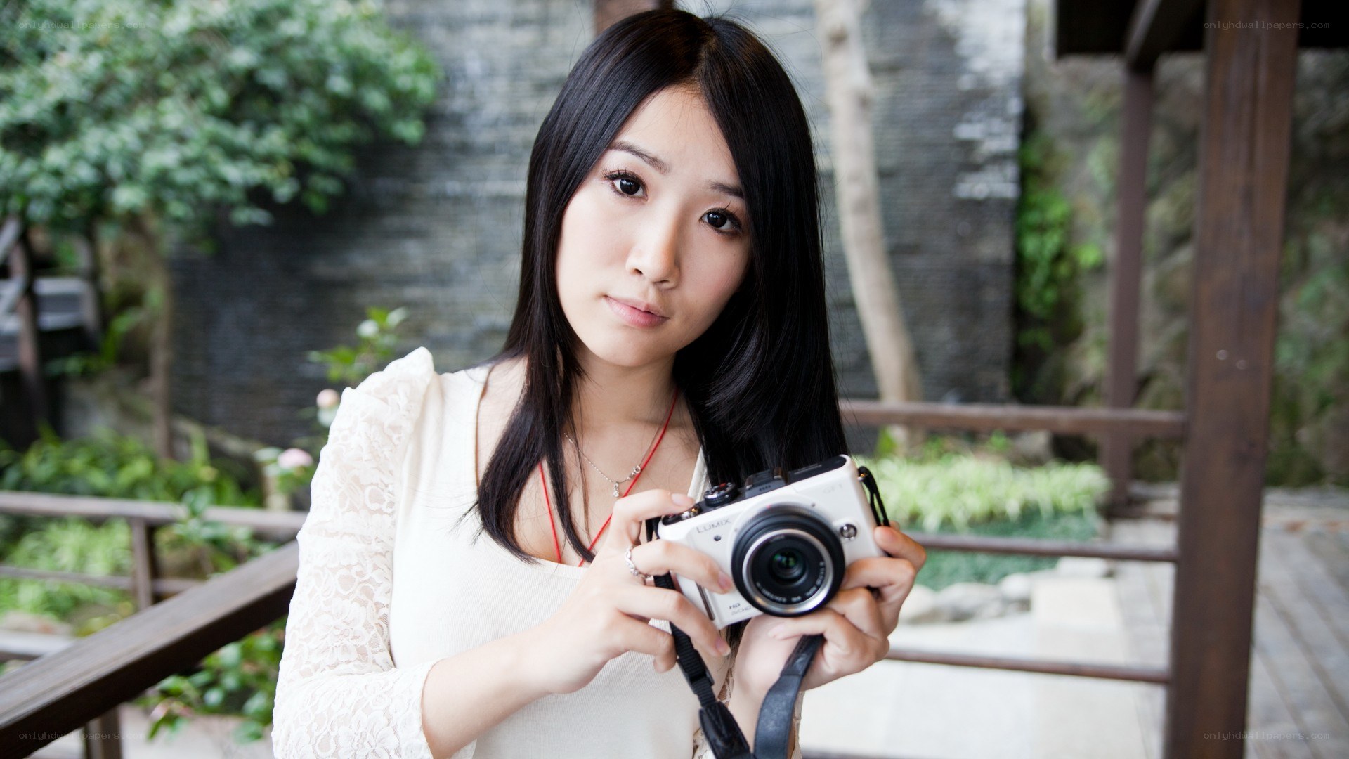 woman holding a camera