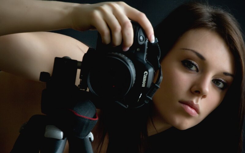 woman holding a camera