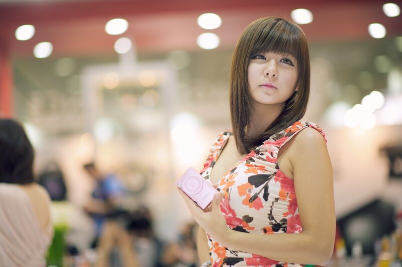 Woman holding a camera at an event