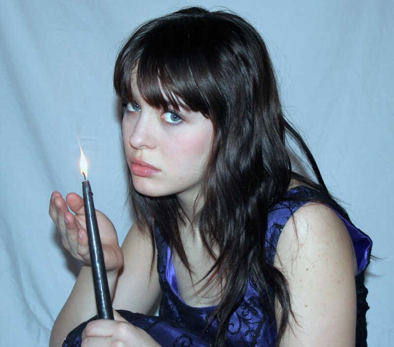 woman holding a candle