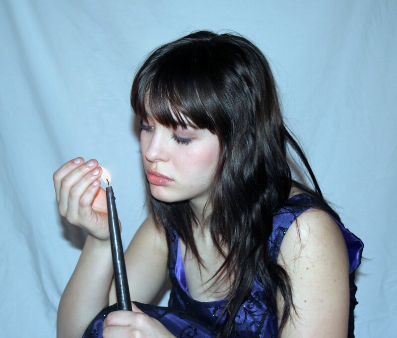 woman holding a candle