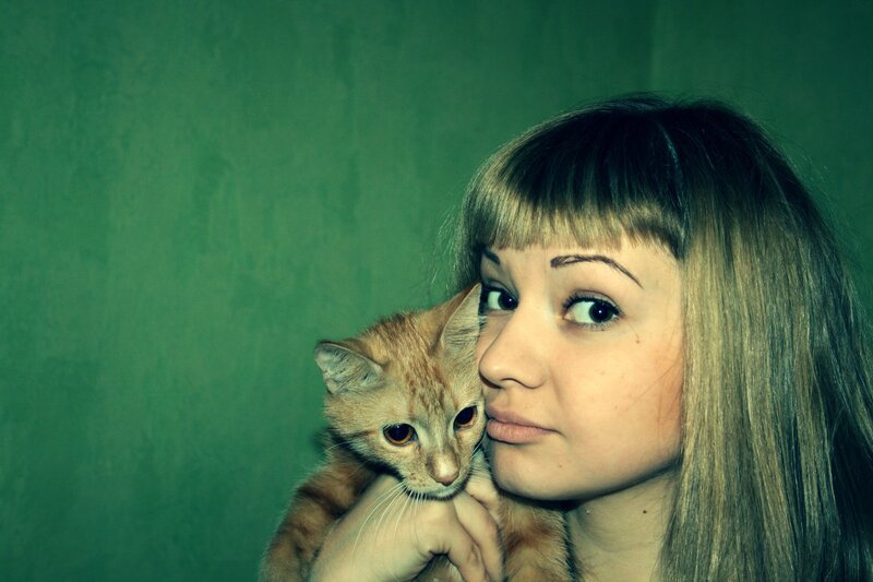 woman holding a cat