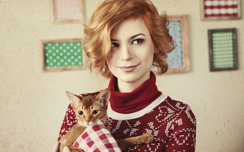 woman holding a cat