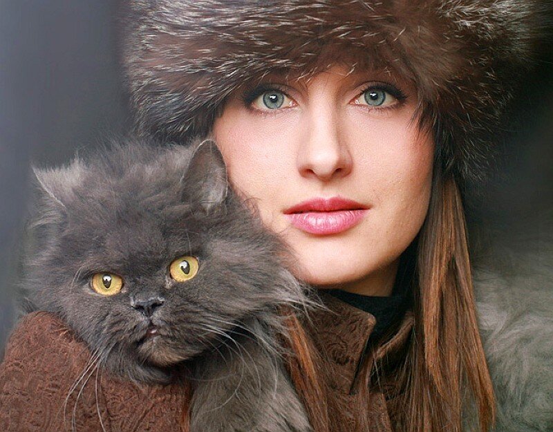 woman holding a cat