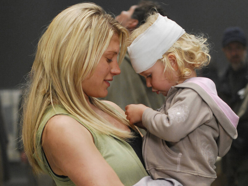 woman holding a child