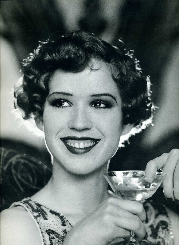 woman holding a cocktail glass