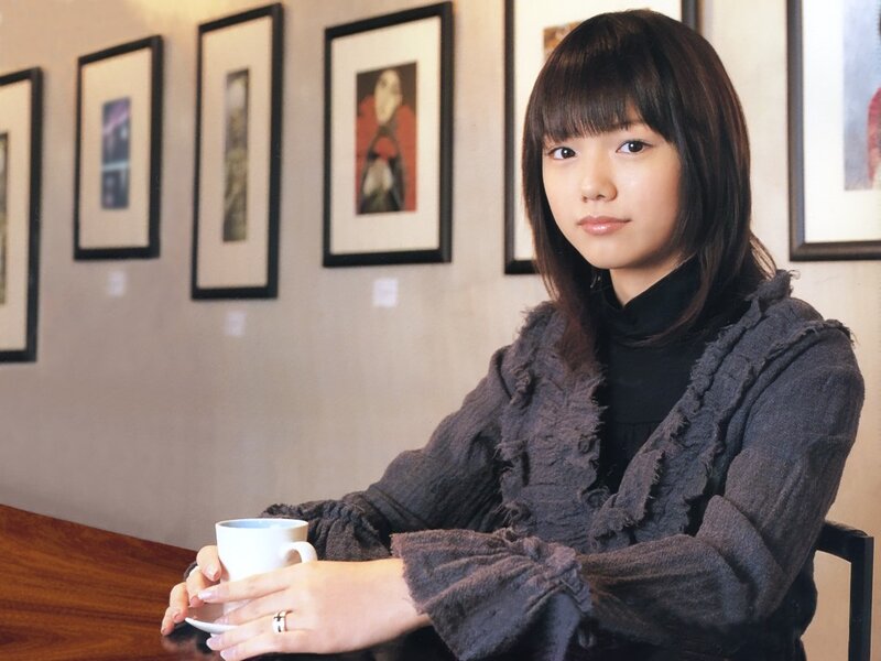 Woman holding a coffee cup