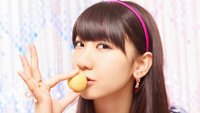 woman holding a cookie