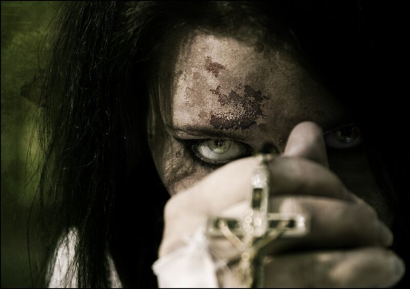 woman holding a cross