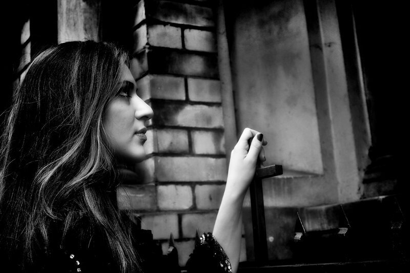 woman holding a cross