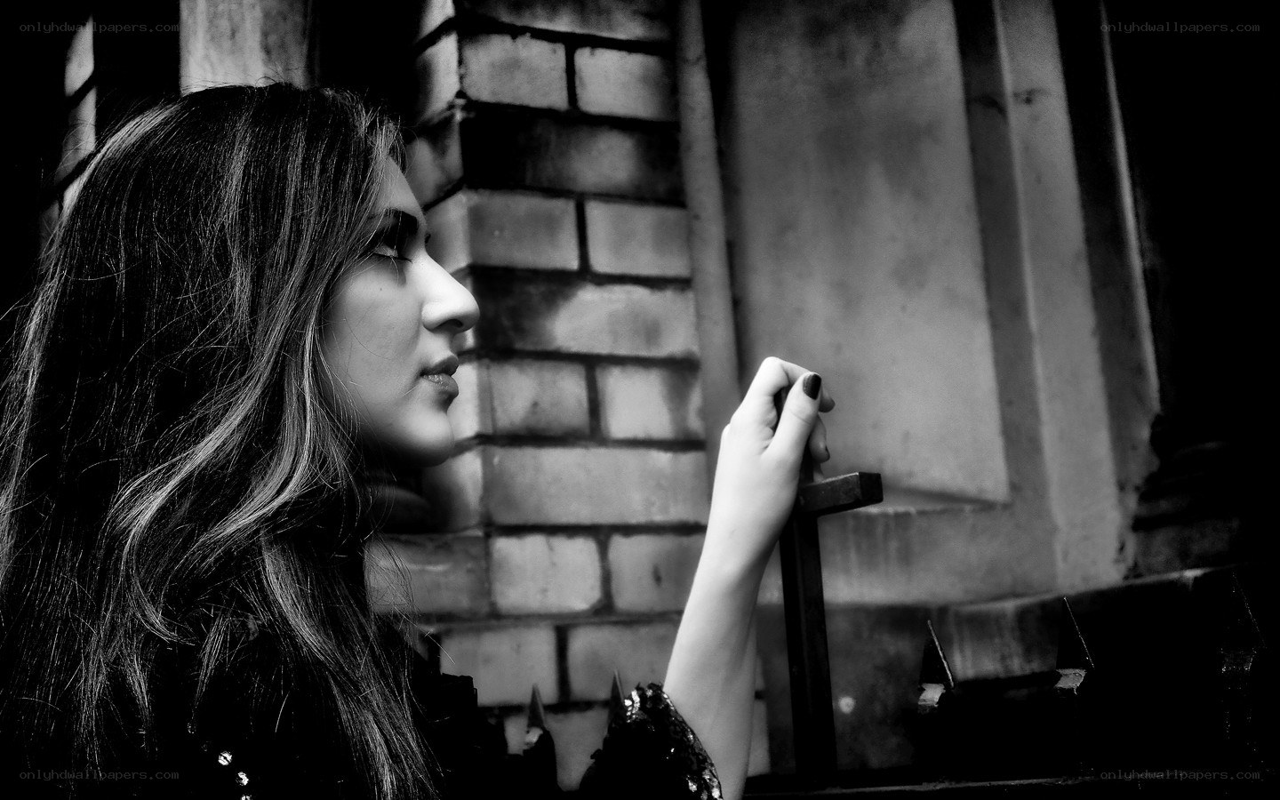 woman holding a cross