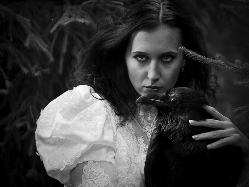 Woman Holding a Crow — Black