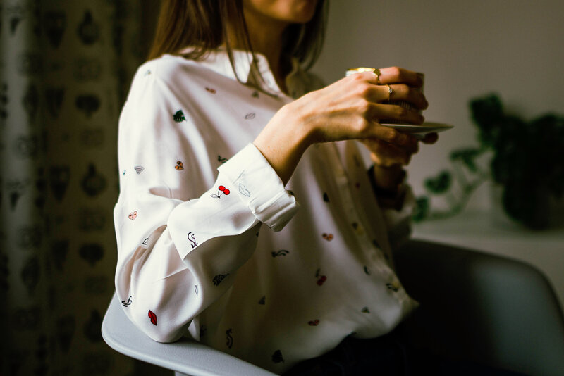 woman holding a cup