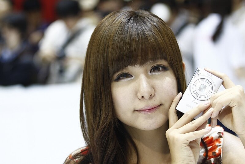Woman holding a digital camera