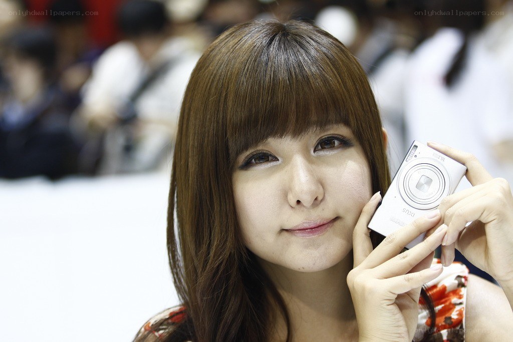 Woman holding a digital camera