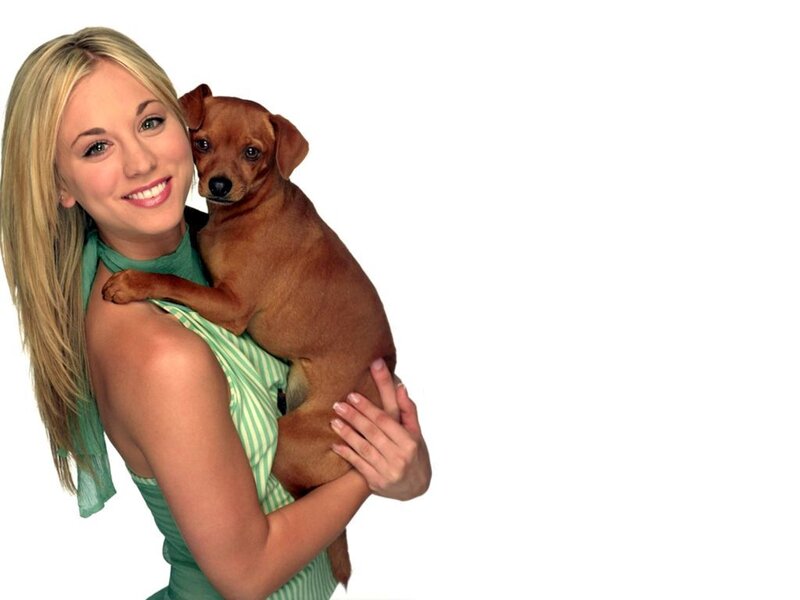 woman holding a dog