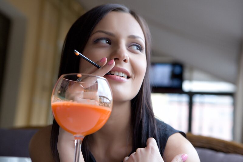 woman holding a drink