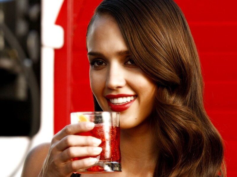 woman holding a drink