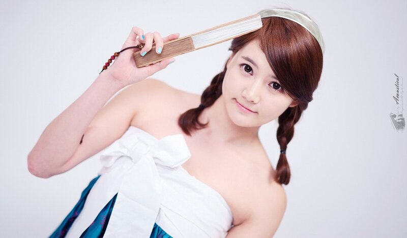 woman holding a fan