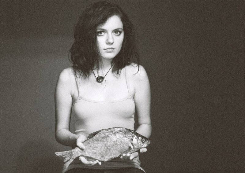 woman holding a fish