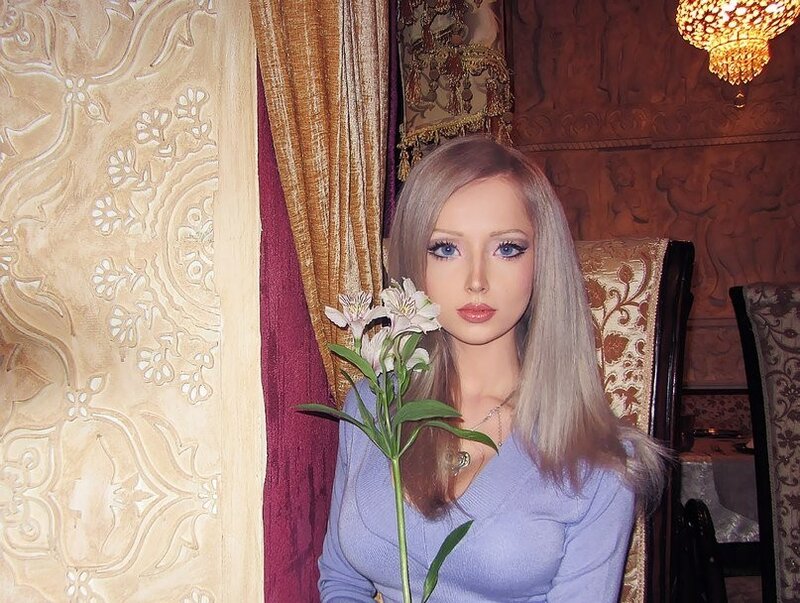 woman holding a flower