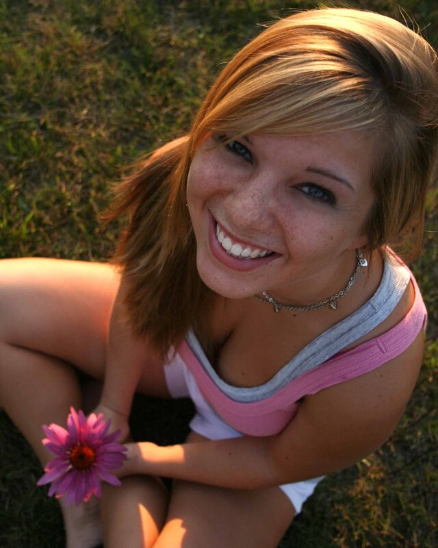 woman holding a flower