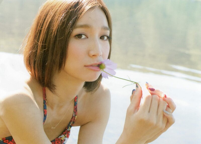 woman holding a flower