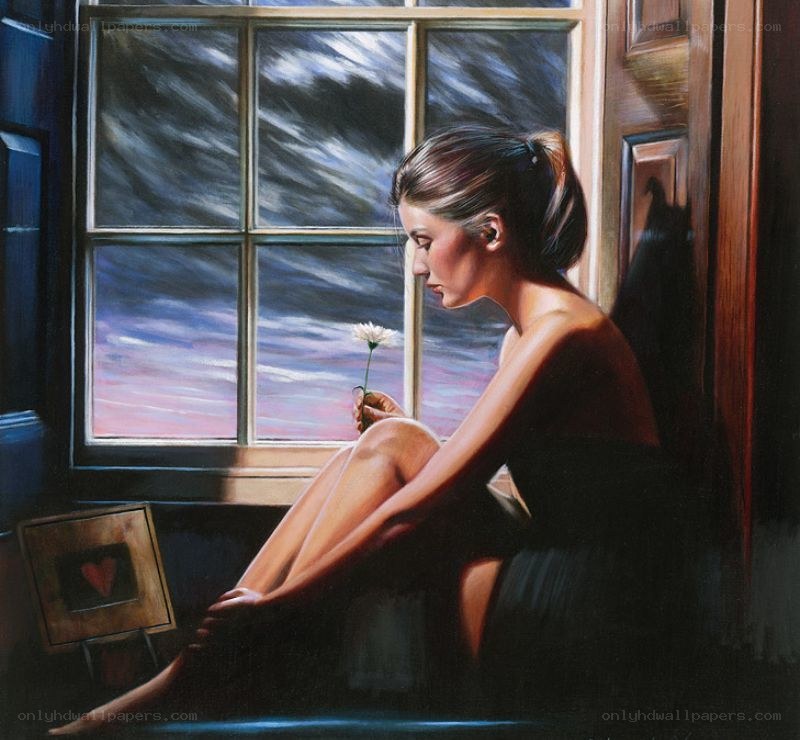 woman holding a flower by window