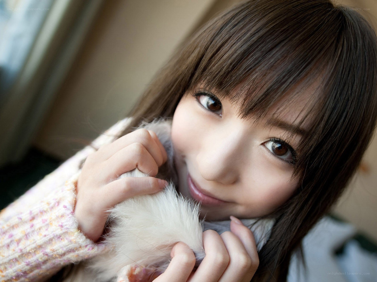woman holding a fluffy object