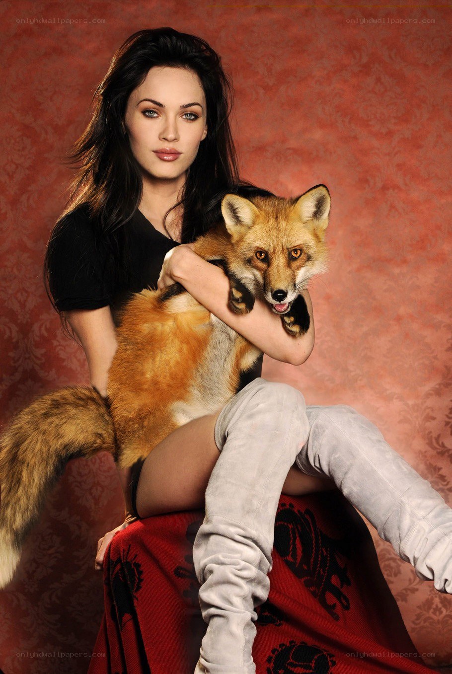 Woman holding a fox