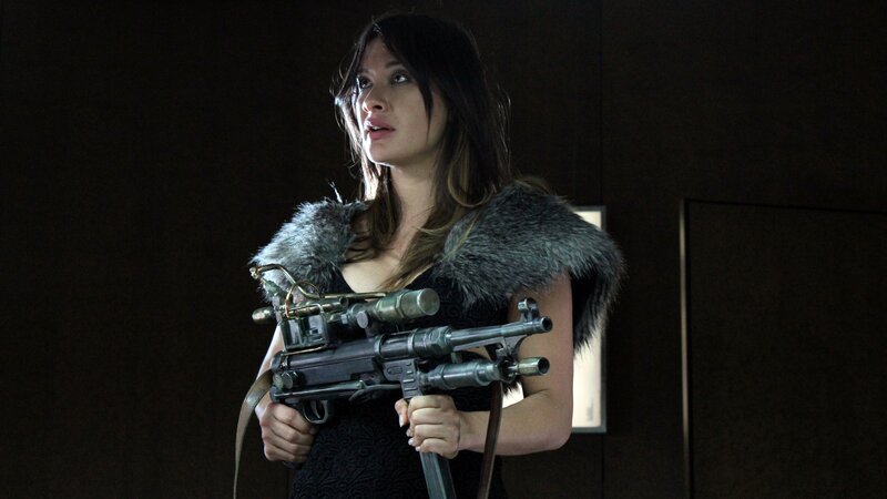 Woman holding a futuristic weapon